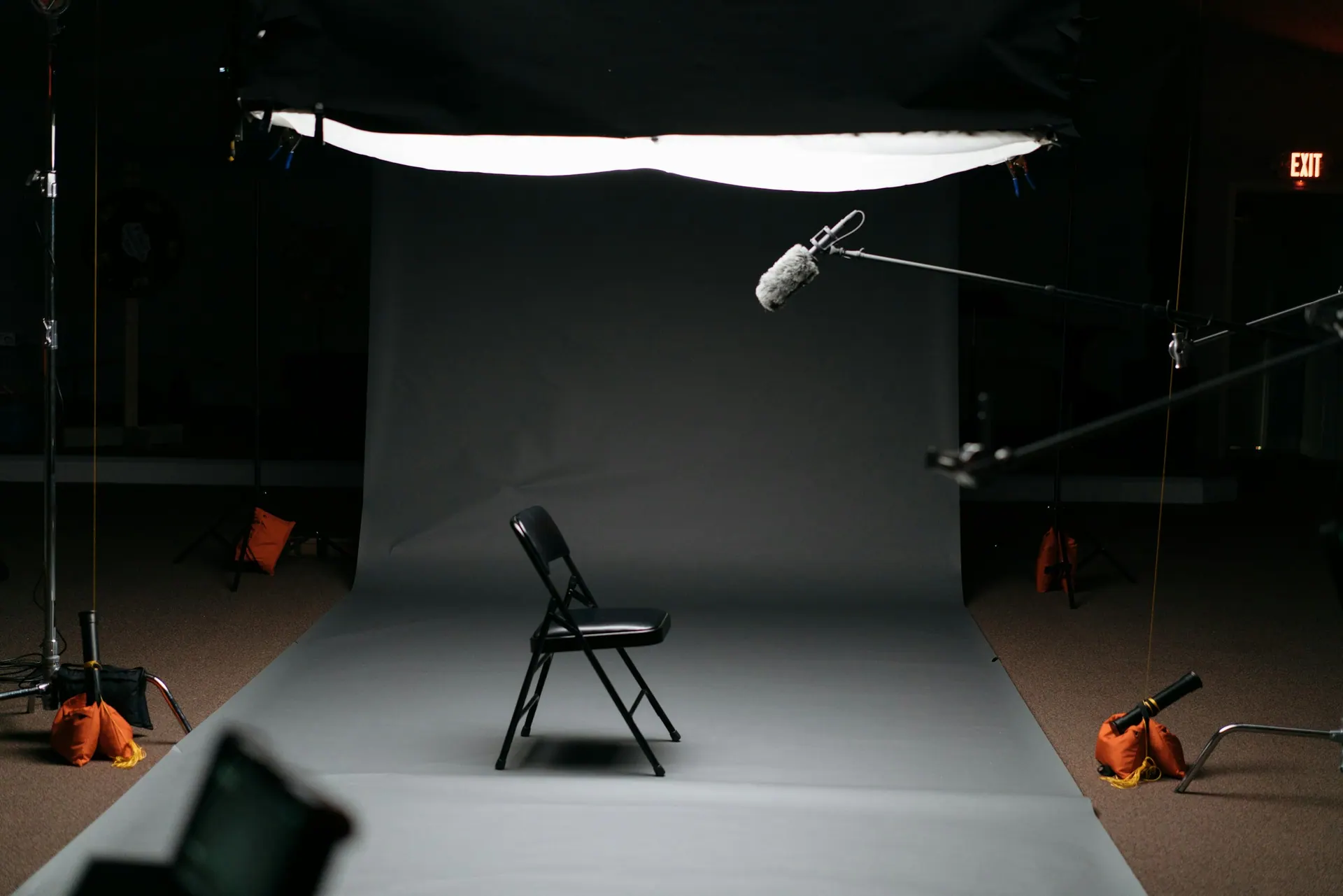 A product photography setup with a small item lit on a clean seamless surface.