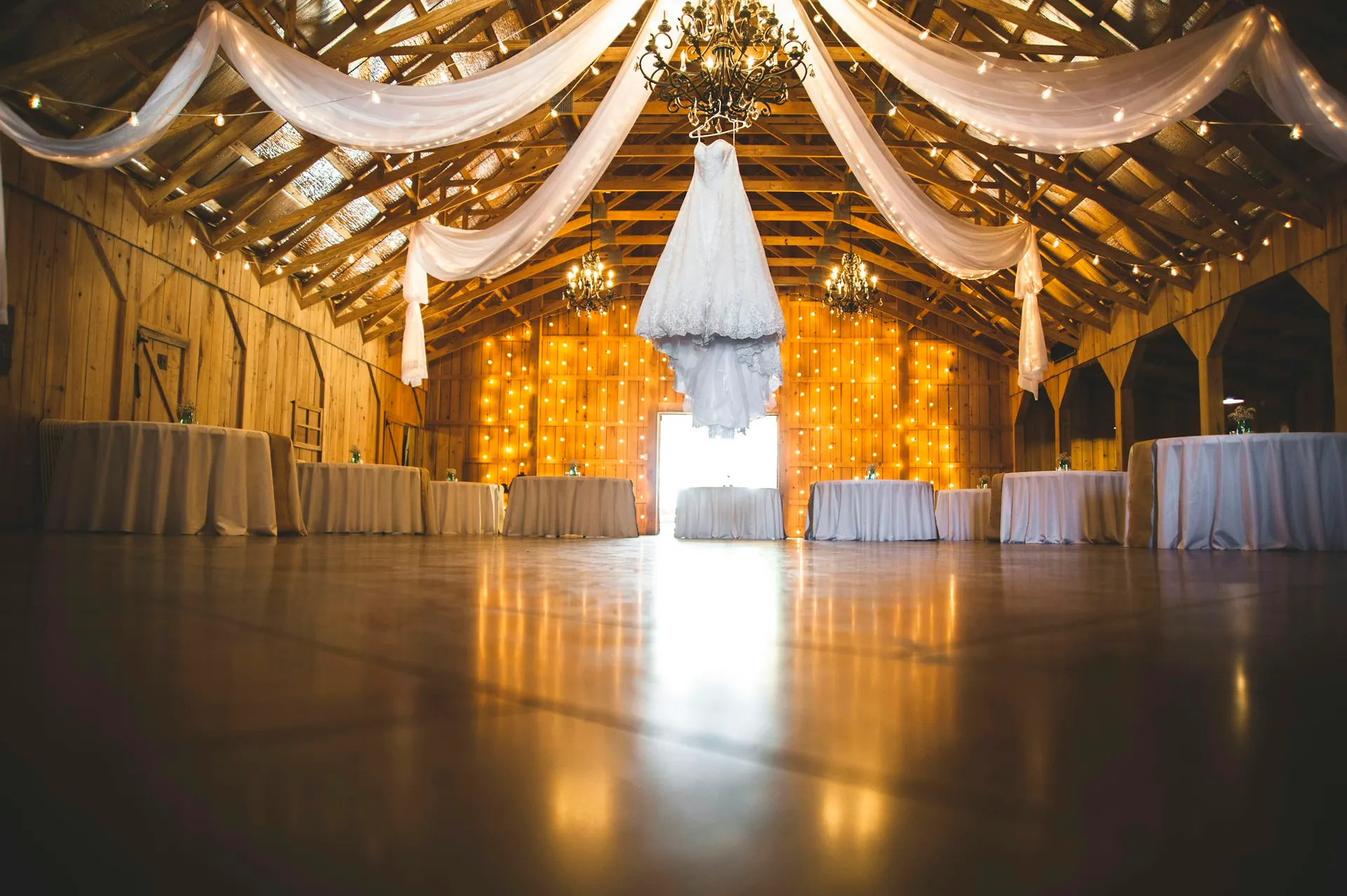 An event venue with atmospheric lighting set up ahead of guests arriving.