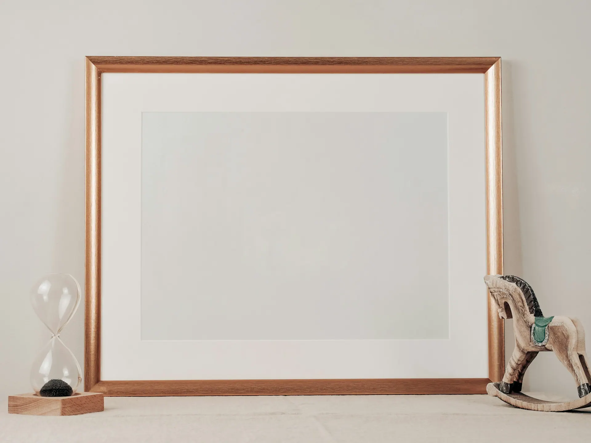 A framing workshop with mouldings, mount board and assembled picture frames.