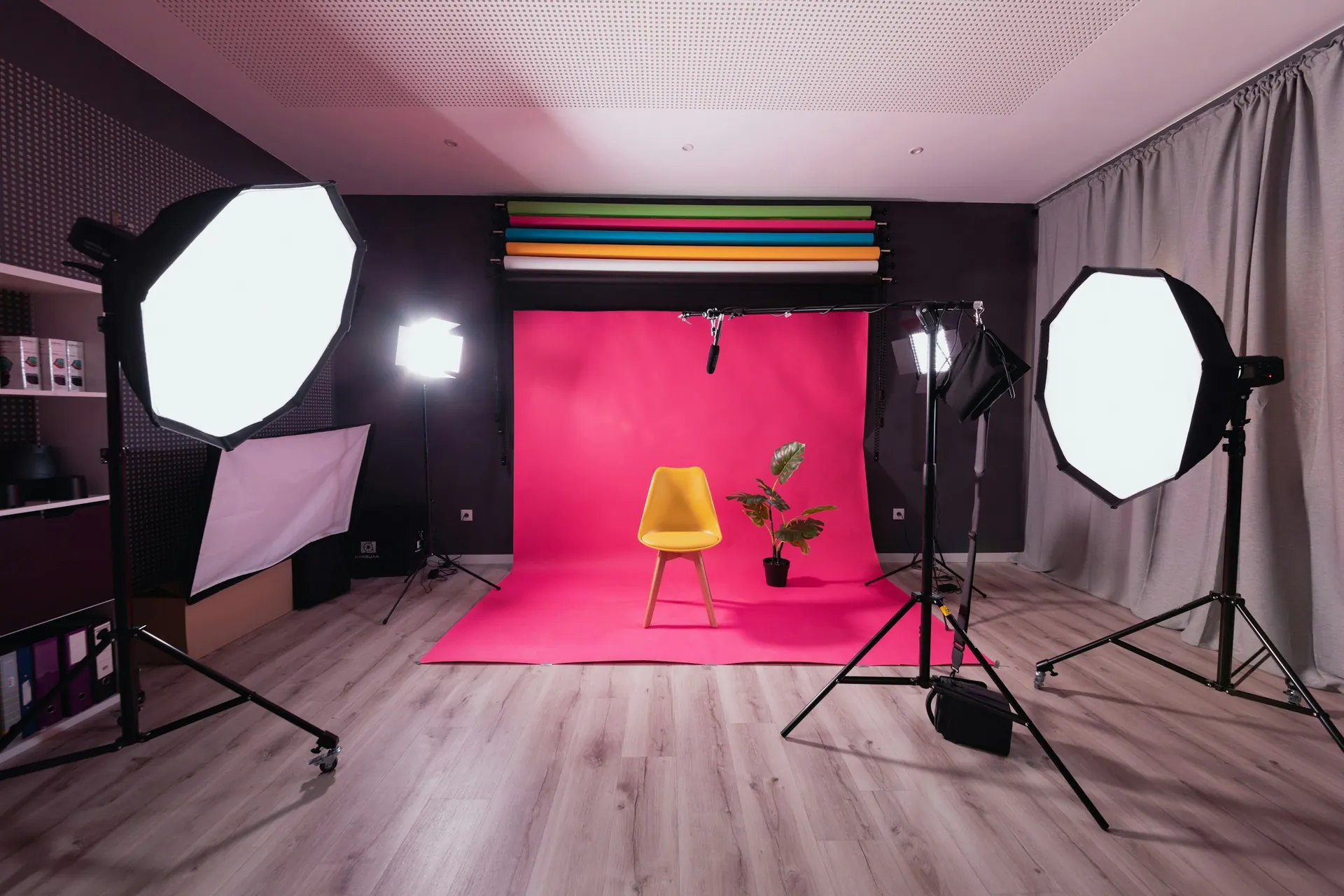 Studio lighting with a large softbox positioned to shape light across a shooting area.